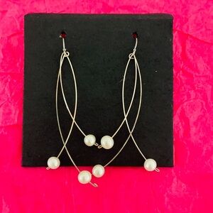 Silver Dangling Earrings with pearls in box.